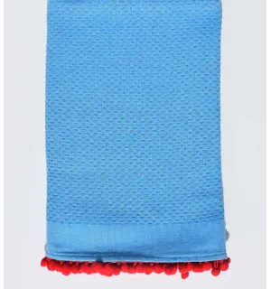Toalla de playa azul celeste con pompones rojos Fouta Tunisia - 1