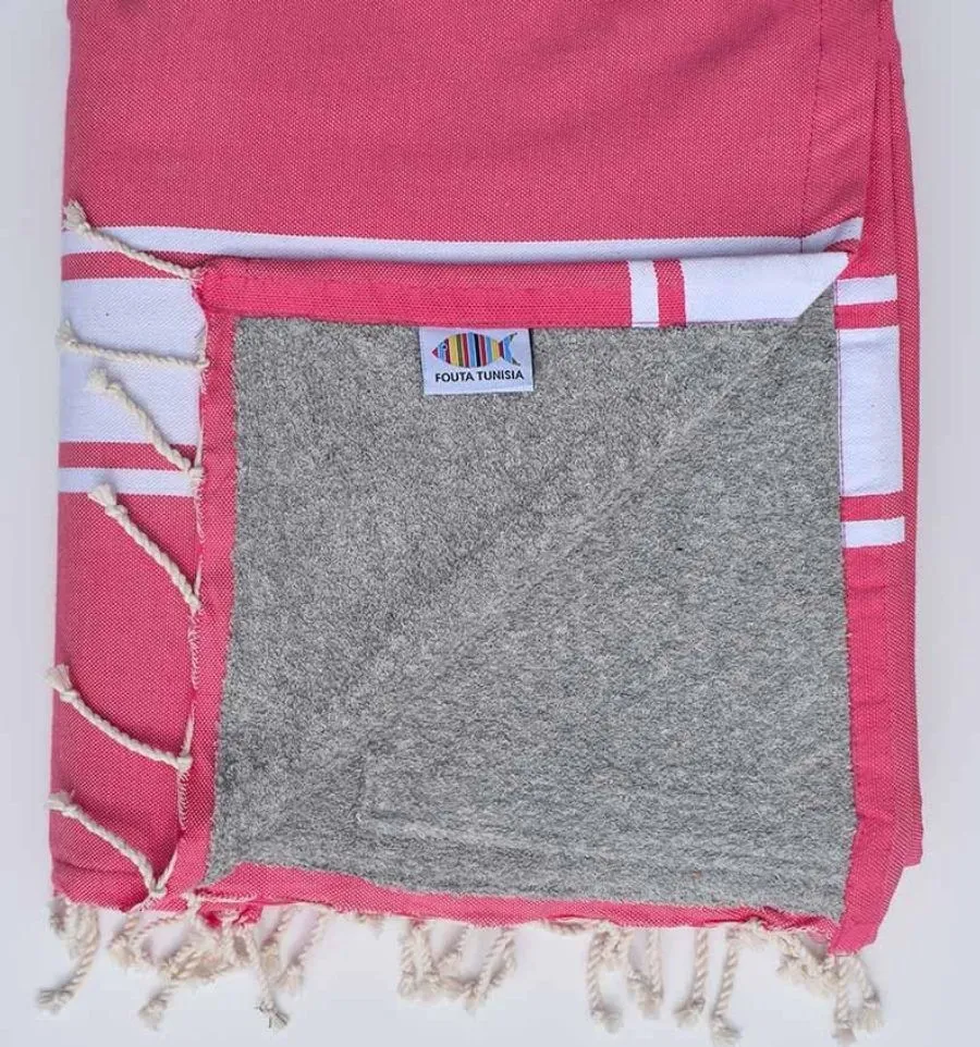 Toalla de playa rosa fresa forrada con esponja gris - FOUTA TUNISIA
