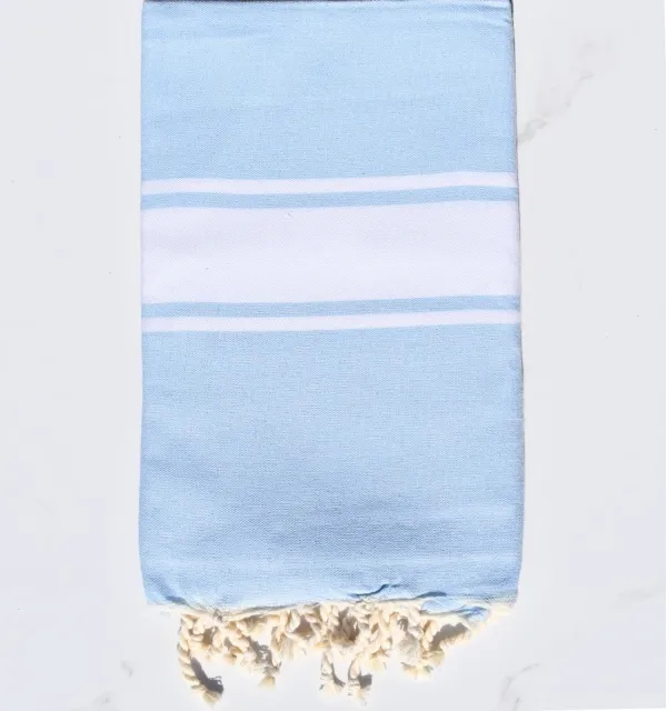 Toalla de playa azul celeste tejido liso - FOUTA TUNISIA